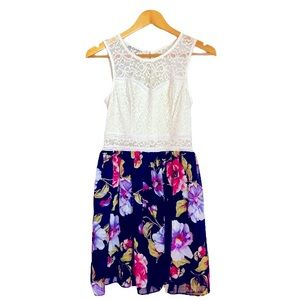 White and floral dress. Size 7. Worn only once, in excellent condition.